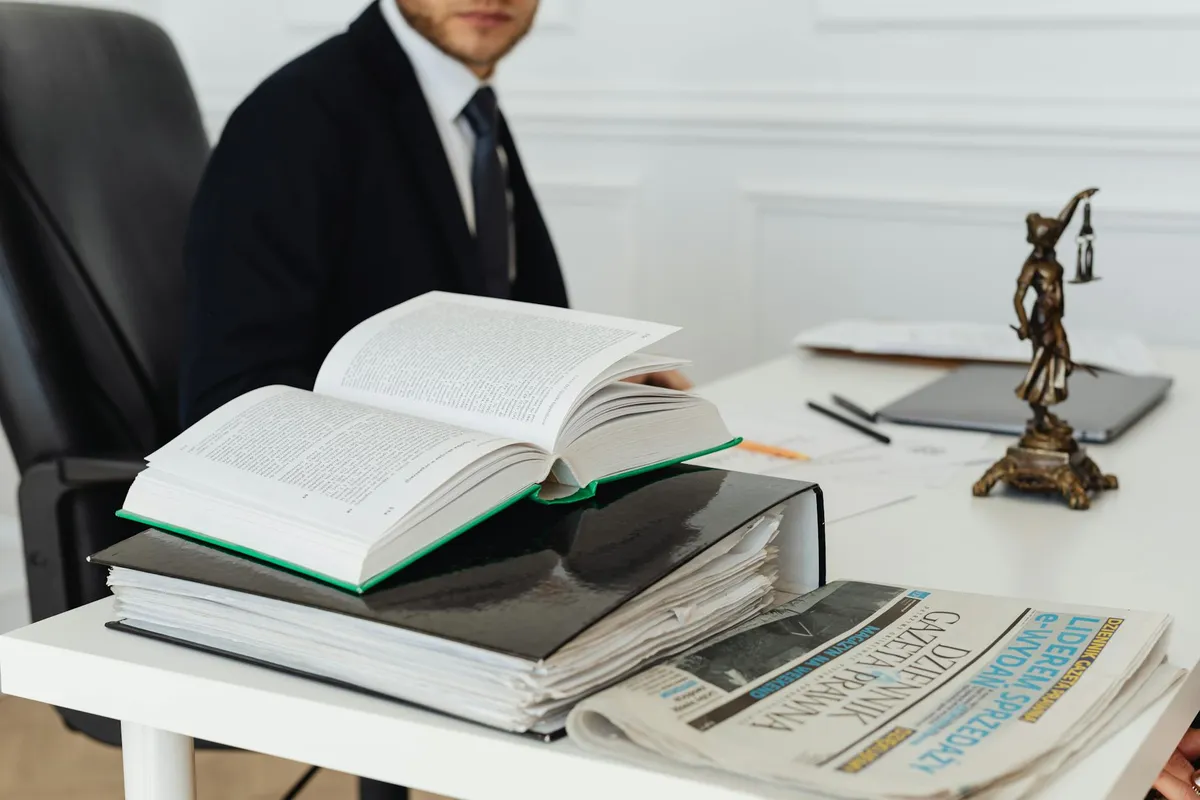 A stack of legal documents on a desk